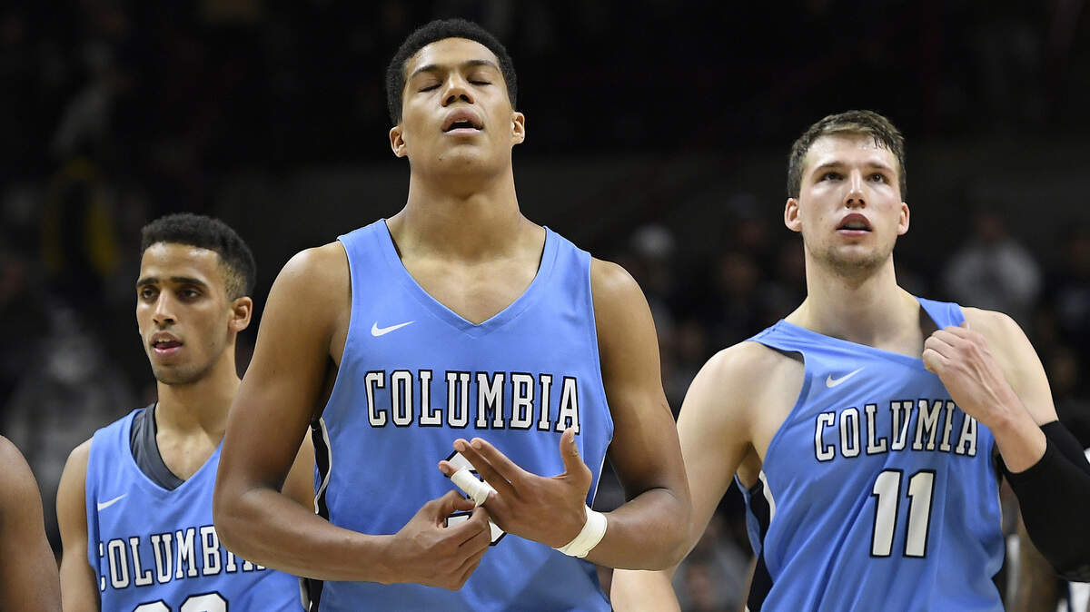 Columbia’s Patrick Tape (center).