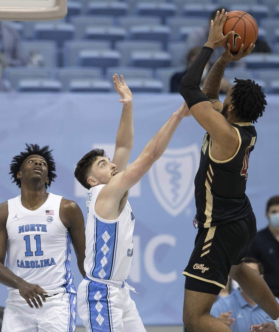 North Carolina’s Andrew Platek (3) defends College of Charleston’s Dontavius King (4) during the first half on Wednesday, November 25, 2020 at the Smith Center in Chapel Hill, N.C.