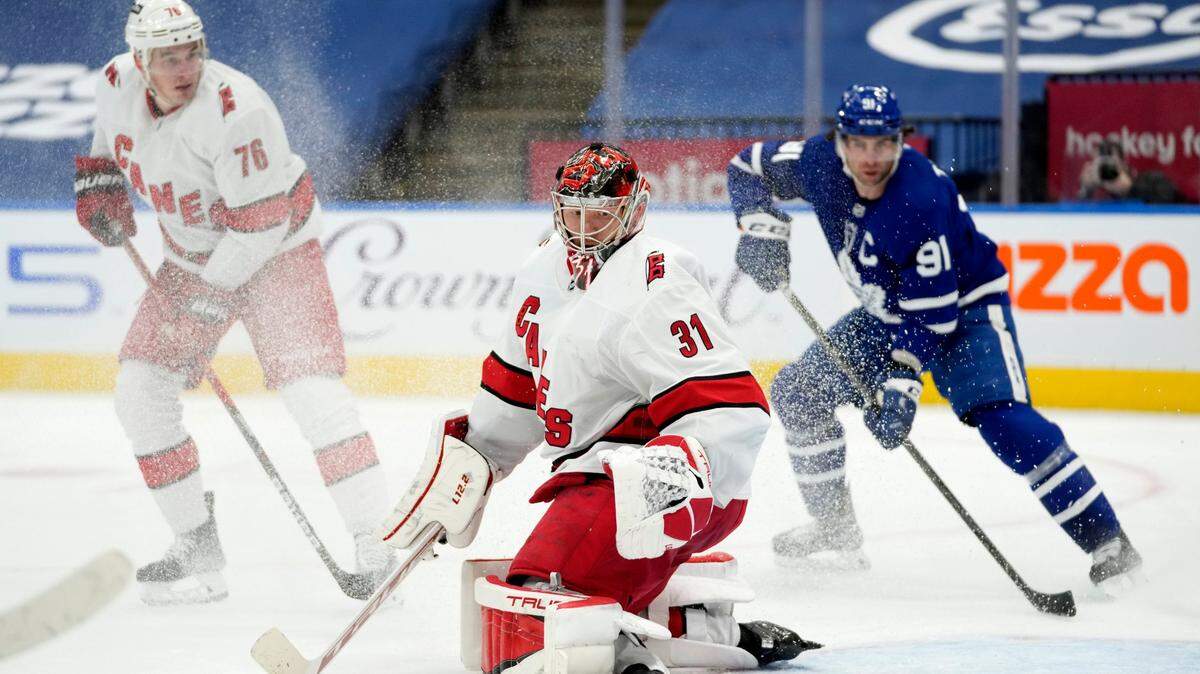 Carolina Hurricanes goaltender Frederik Andersen (31) makes a save during the second period of an NHL hockey game against the Toronto Maple Leafs, in Toronto, Monday, Feb. 7, 2022. (Frank Gunn/The Canadian Press via AP)