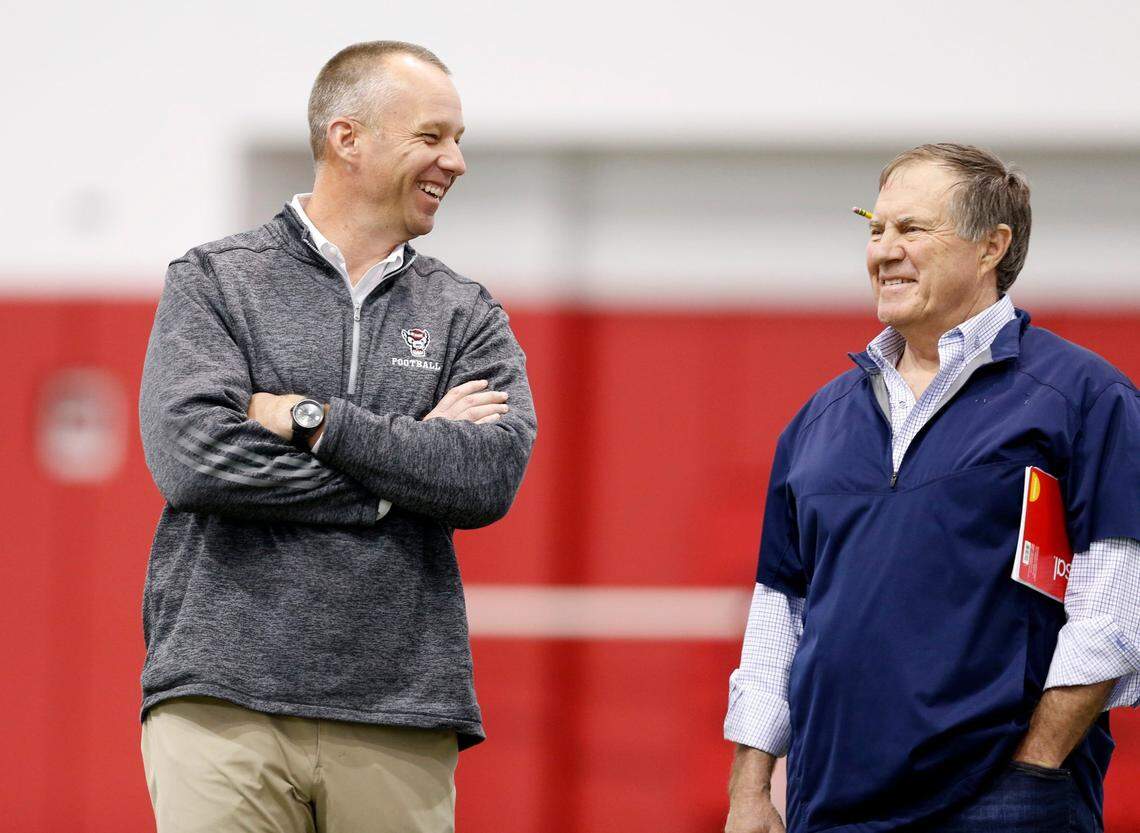 N.C. State head coach Dave Doeren laughs with New England Patriots head coach Bill Belichick during the Wolfpack’s Pro Day at the Close-King Indoor Practice Facility in March 2018.