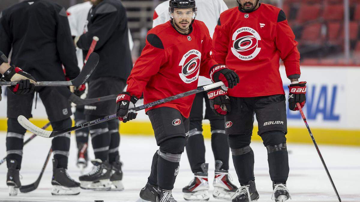 Carolina Hurricanes centers Logan Stankoven (22) and Seth Jarvis (24) take to the ice for their practice on Tuesday, May 12, 2026, at Lenovo Center in Raleigh, N.C.