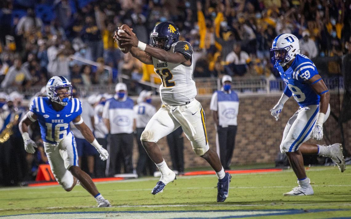 North Carolina A&T’s Kingsley Ifedi (12) scores between Duke’s Jaylen Stinson (16) and Michael Reesse (59) to tie Duke 14-14 in the second quarter on Friday, September 10, 2021 at Wallace Wade Stadium in Durham, N.C.