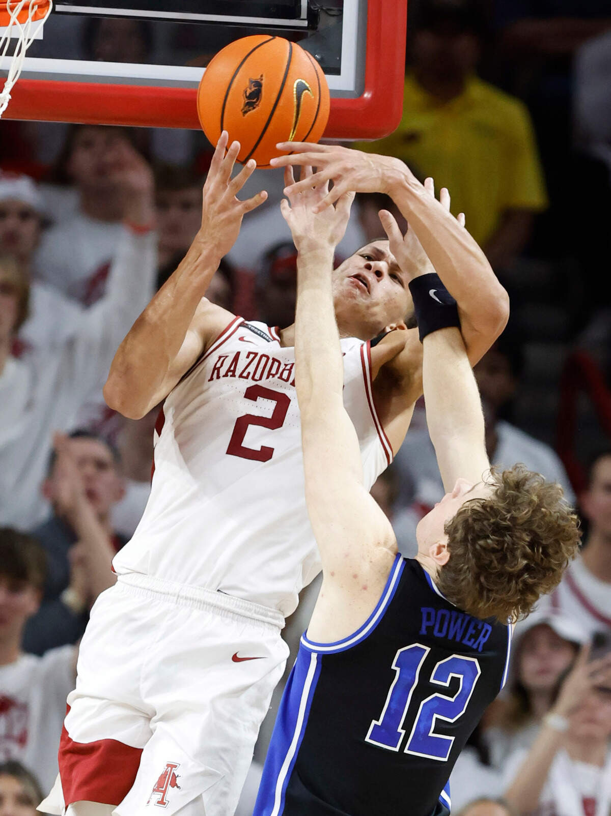 Arkansas’ Trevon Brazile (2) pulls in the rebound from Duke’s TJ Power (12) during the second half of Arkansas’ 80-75 victory over Duke at Bud Walton Arena in Fayetteville, Ark., Weds. Nov. 29, 2023.
