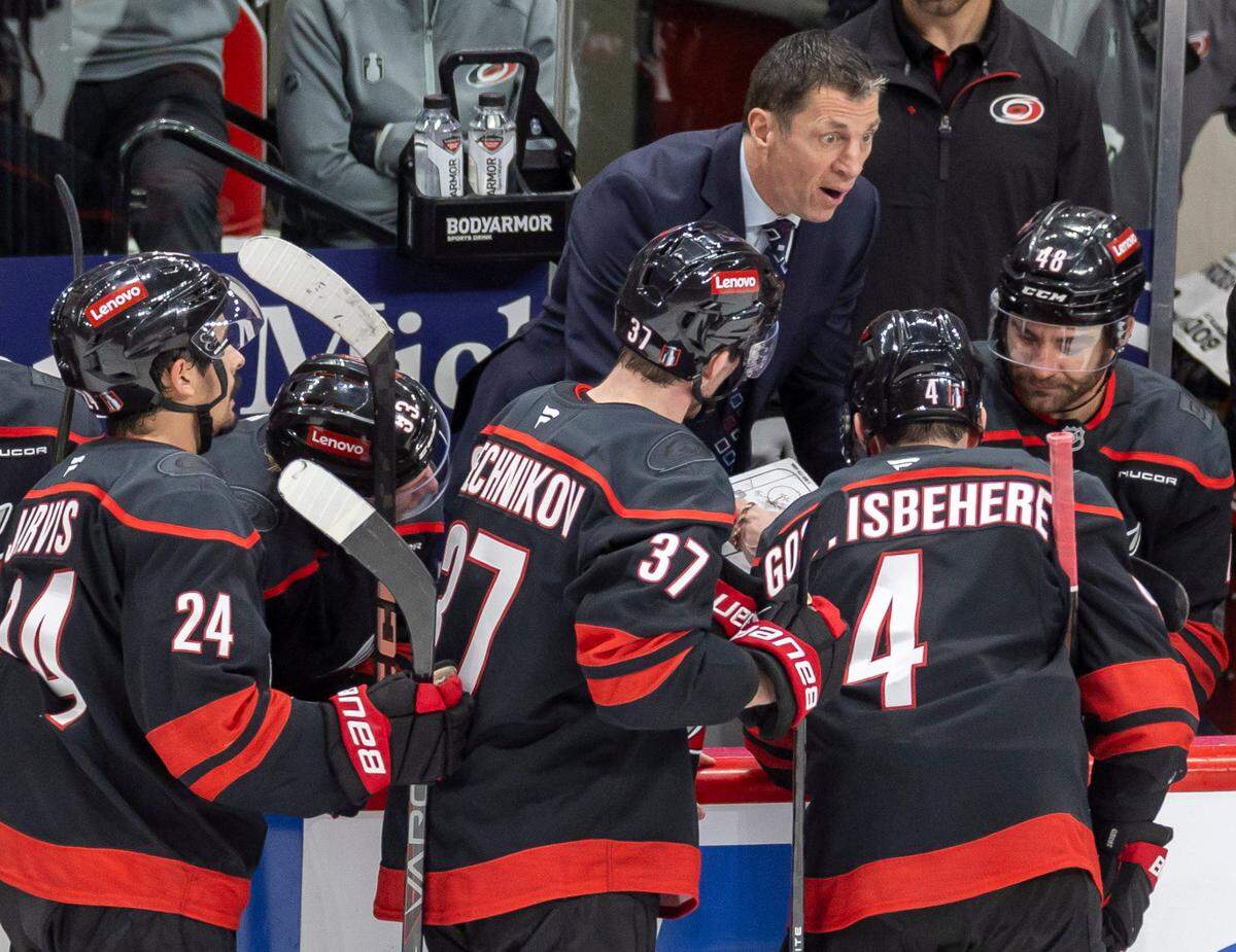 Carolina Hurricanes coach Rod Brind’Amour huddles with his players before a power play opportunity in the second period against the New Jersey Devils on Tuesday, April 29, 2025 at Lenovo Center in Raleigh, N.C.