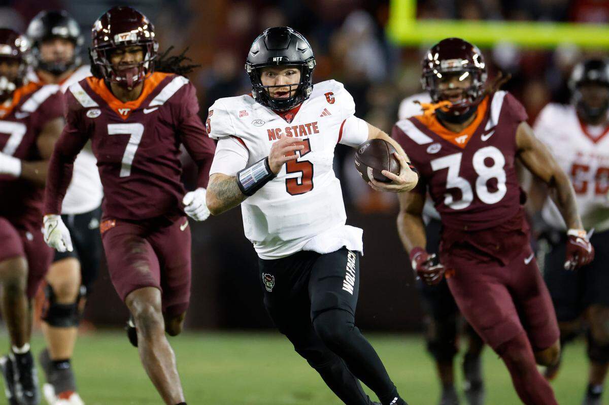 N.C. State quarterback Brennan Armstrong (5) rushes for 43-yards during the second half of N.C. State’s 35-28 victory over Virginia Tech at Lane Stadium in Blacksburg, VA, Saturday, Nov. 18, 2023.