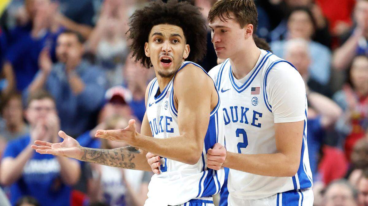 Duke’s Tyrese Proctor (5) disputes the call by the official as Cooper Flagg (2) holds onto him in the second half of Kansas’ 75-72 victory over Duke in the Vegas Showdown at T-Mobile Arena in Las Vegas, Nev., Tuesday, Nov. 26, 2024.