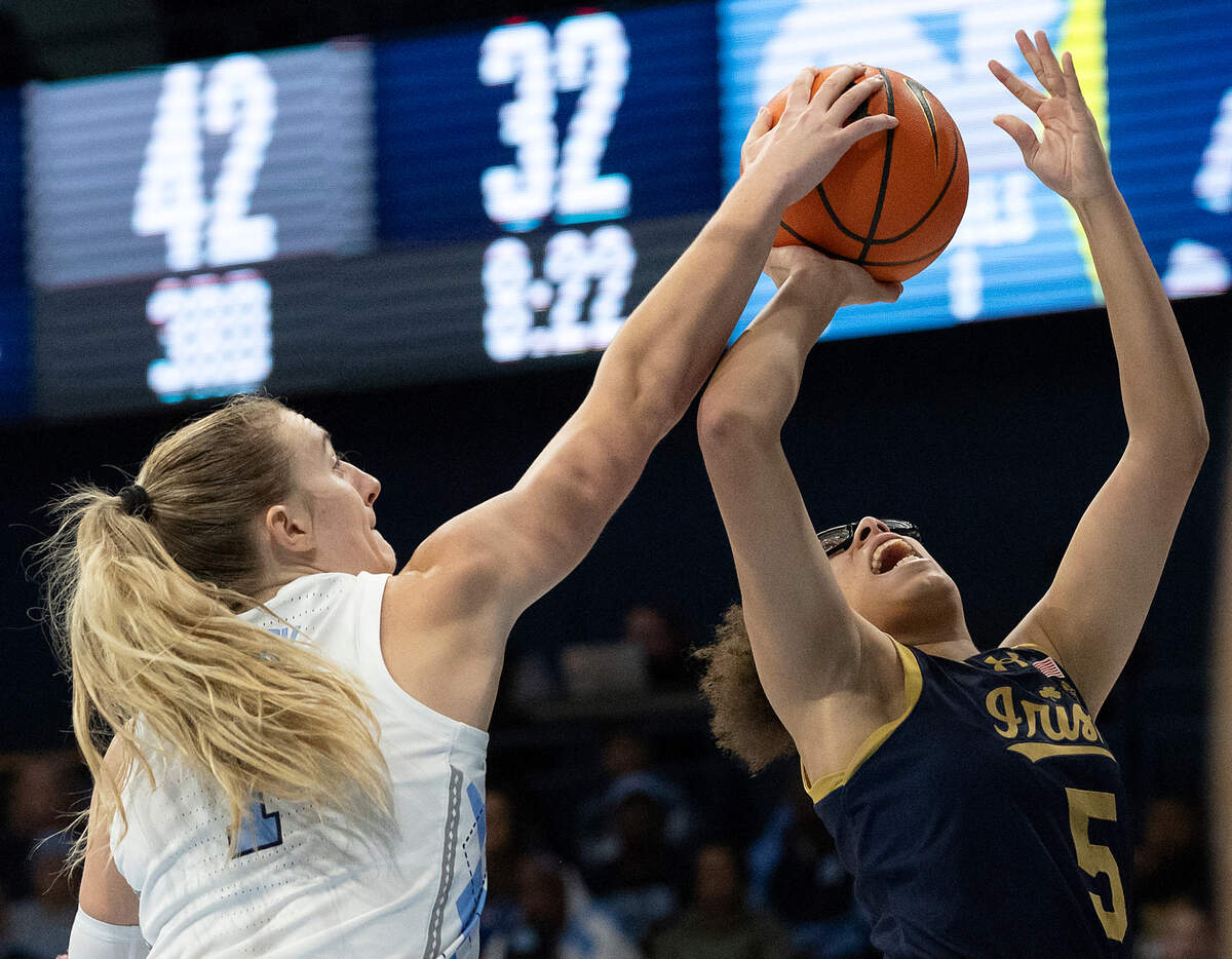 North Carolina’s Alyssa Ustby blocks a shot by Notre Dame’s Olivia Miles during the second half of the Tar Heels’ 76-66 loss on Sunday, Jan. 5, 2025, at Carmichael Arena in Chapel Hill, N.C.
