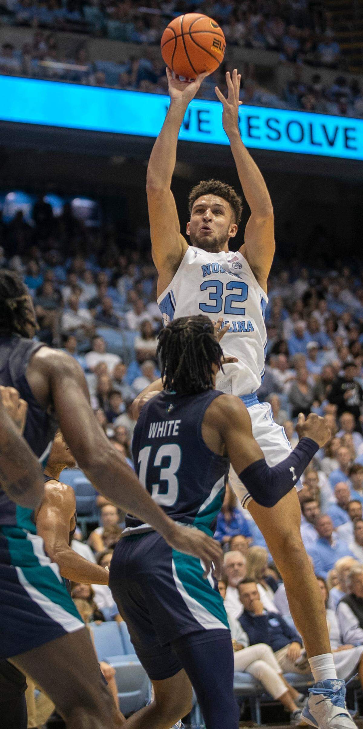 North Carolina’s Pete Nance (32) puts up a shot against UNC Wilmington’s Trazarien White (13) in the first half on Monday, November 7, 2022 at the Smith Center in Chapel Hill, N.C.