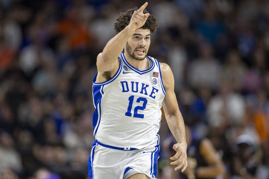 Duke forward Cameron Boozer (12) reacts after a dunk in the second half to give the Blue Devils a commanding 16 point lead over VCU on Saturday, March 21, 2026, during the second round of the NCAA Tournament at Bon Secours Arena in Greenville, S.C.