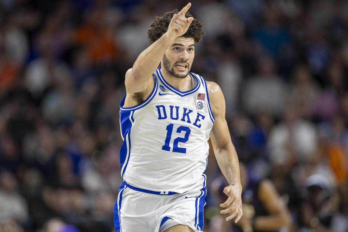 Duke forward Cameron Boozer (12) reacts after a dunk in the second half to give the Blue Devils a commanding 16 point lead over VCU on Saturday, March 21, 2026, during the second round of the NCAA Tournament at Bon Secours Arena in Greenville, S.C.