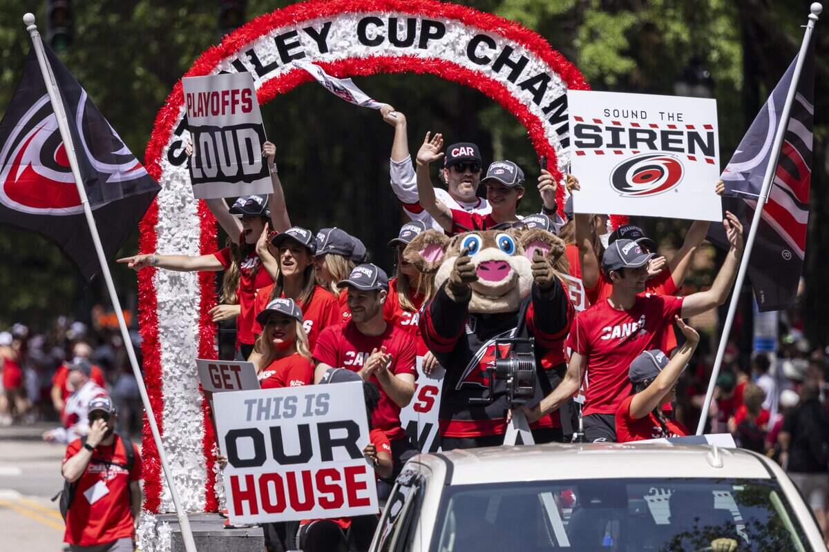 Thousands of Carolina Hurricanes fans gather in downtown Raleigh on Saturday, June 20, 2026, during a parade and rally celebrating the Hurricanes' Stanley Cup Final victory over the Vegas Golden Knights. The Hurricanes won the series 4-2 to capture the Stanley Cup for the second time since 2006.