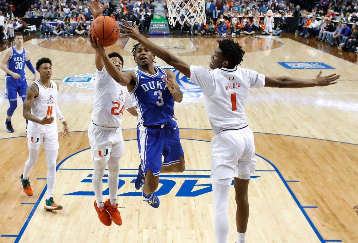 Duke’s Jeremy Roach (3) heads to the basket past Miami’s Nijel Pack (24) and Anthony Walker (1) during Duke’s 85-78 victory over Miami in the semifinals of the ACC Men’s Basketball Tournament in Greensboro, N.C., Friday, March 10, 2023.