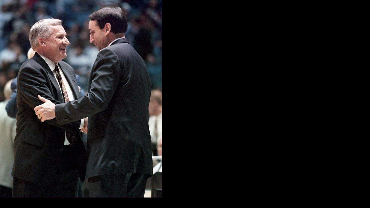 North Carolina's Dean Smith and Duke's Mike Krzyzewski shake hands before a game in 1996.


