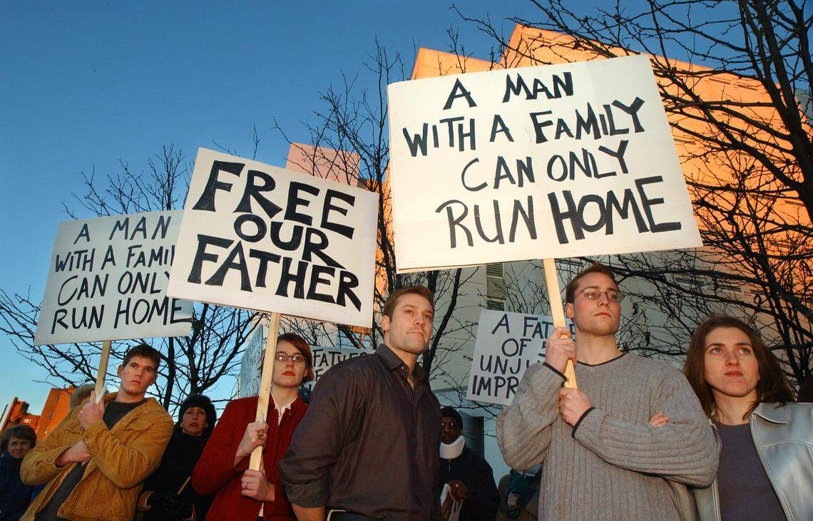 About 40 family and friends of Michael Peterson held a vigil outside the Durham County Detention Facility January 11, 2002 support for the former candidate for city council and the mayor’s office, who was charged in the murder of his wife Kathleen. Pictured left to right in front of the jail is family friend Tim Jacobi, Peterson’s daughter Martha Ratliff, son, Todd Peterson, son Clayton Peterson, and Clayton’s girlfriend Becky Seibert.