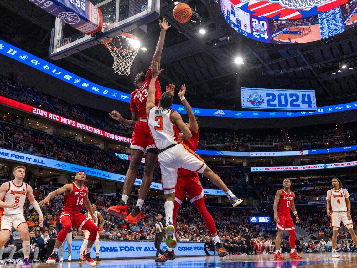 N.C. State’s Mohamed Diarra (23) blocks a shot by Syracuse’s Judah Mintz (3) in the second half during the ACC Men’s Basketball Tournament at Capitol One Arena on Wednesday, March 13, 2024 in Washington, D.C.