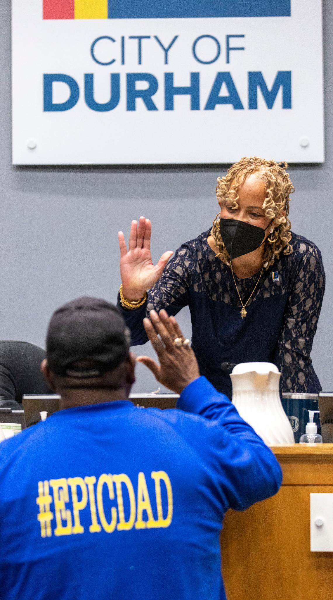 Dennis Garrett, a member of the Durham Community Outreach Team, gives Durham Mayor Elaine O’Neal a high five following her ‘State of the City Address’ on Monday, April 18, 2022 at City Hall in Durham, N.C. O’Neal referred to Garrett and other members of the outreach team as ‘The Reformers’ as they work to stem gun violence in Durham.
