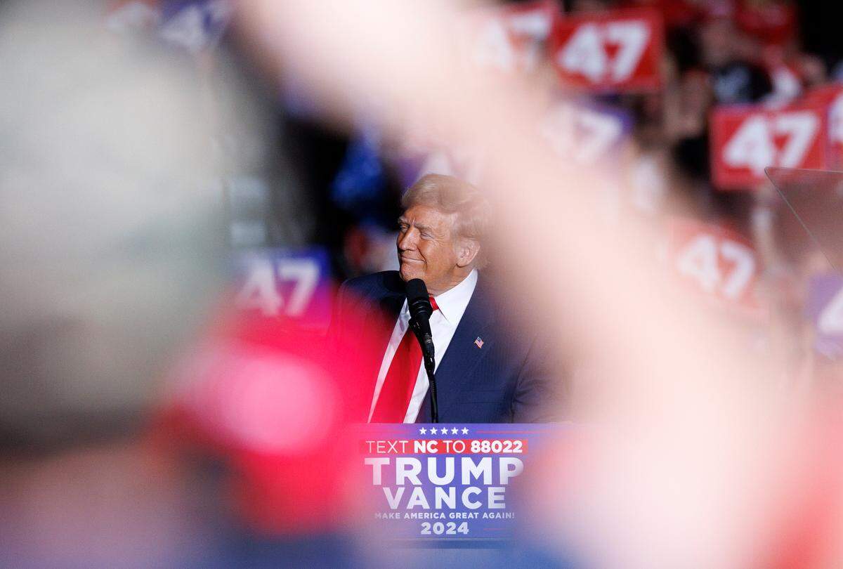 Former President and Republican presidential candidate Donald Trump smiles during his remarks at a campaign rally at the Greensboro Coliseum Complex on Tuesday, Oct. 22, 2024, in Greensboro, N.C.