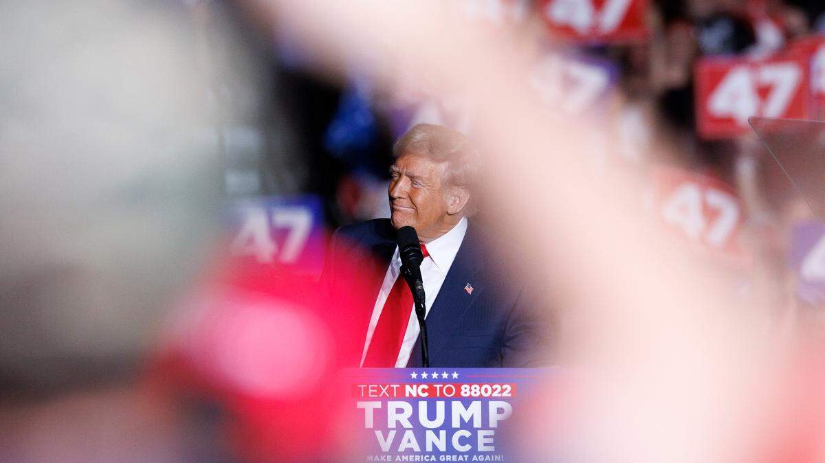 Former President and Republican presidential candidate Donald Trump smiles during his remarks at a campaign rally at the Greensboro Coliseum Complex on Tuesday, Oct. 22, 2024, in Greensboro, N.C.