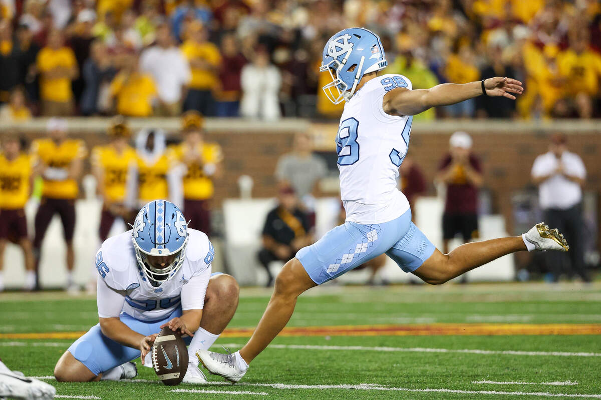 North Carolina Tar Heels place kicker Noah Burnette (98) kicks a field goal against the Minnesota Golden Gophers during the second half at Huntington Bank Stadium.