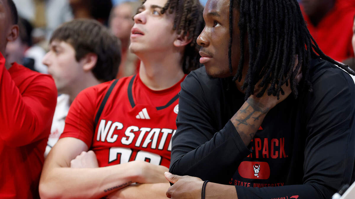 N.C. State’s Jordan Snell and Mike James watch during the first half of the Wolfpack’s 97-73 loss to North Carolina on Wednesday, Feb. 19, 2025, at the Smith Center in Chapel Hill, N.C.