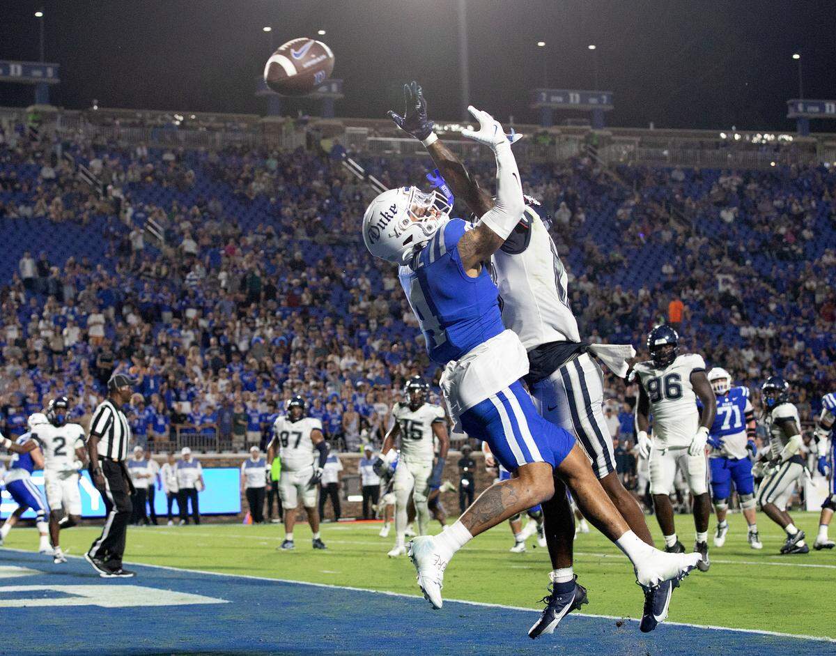 A pass intended for Duke’s Eli Pancol falls incomplete under pressure from Connecticut’s Cam Chadwick during the second half of the Blue Devils’ 26-21 win on Saturday, Sept. 14, 2024, at Wallace Wade Stadium in Durham, N.C.