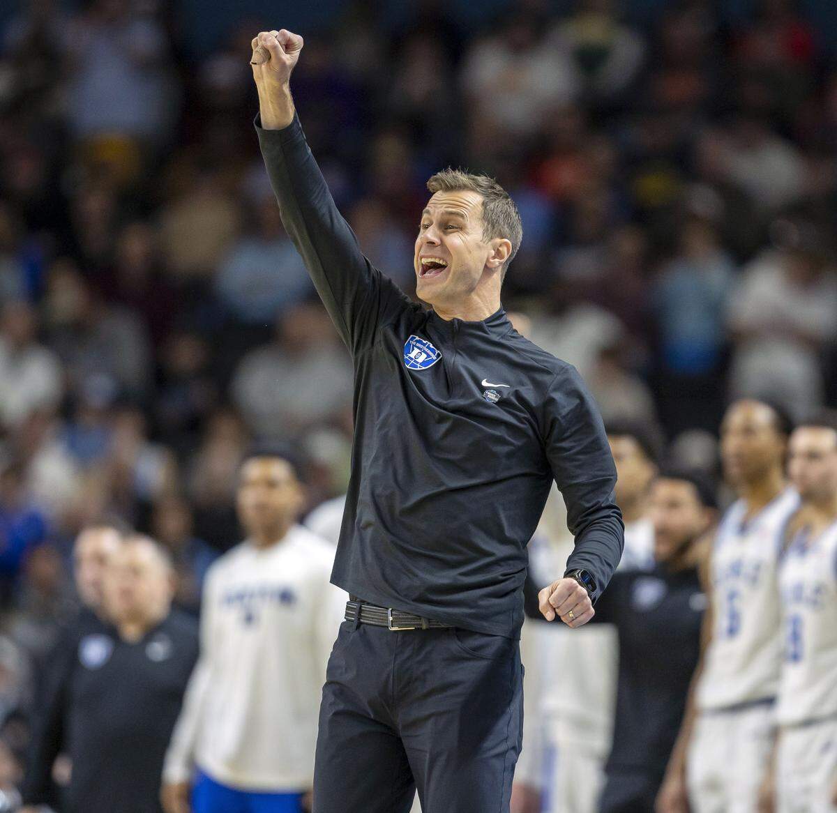 Duke coach Jon Scheyer directs his team on defense as they cut into the Siena lead during the second half on Thursday, March 18, 2026, during the first round of the NCAA Tournament at Bon Secours Arena in Greenville, S.C.