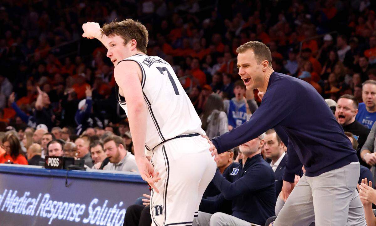 Duke head coach Jon Scheyer congratulates Kon Knueppel (7) after he hit a three-pointer during the second half of Duke’s 110-67 victory over Illinois in the SentinelOne Classic at Madison Square Garden in New York City Saturday, Feb. 22, 2025.