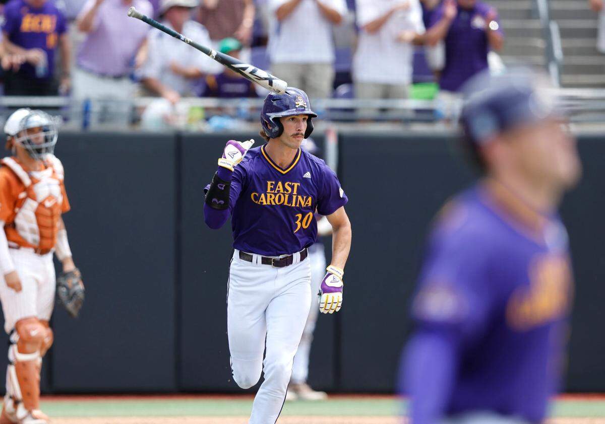 East Carolina’s Jacob Jenkins-Cowart (30) flips his bat watching his homerun in the fifth inning during ECUs game against Texas in the Greenville Super Regional at Clark-LeClair Stadium Saturday, June 11, 2022.