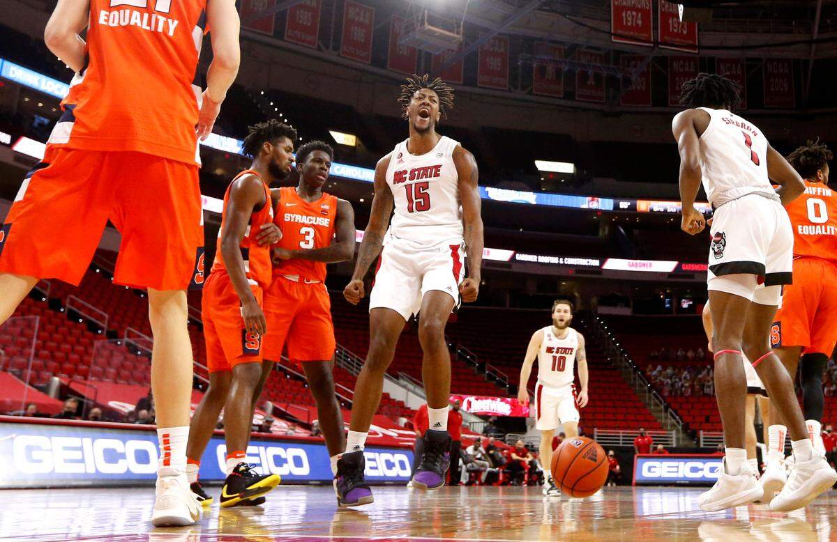 N.C. State’s Manny Bates (15) celebrates slamming in two during Syracuse’s 77-68 victory over N.C. State at PNC Arena in Raleigh, N.C., Tuesday, February 9, 2021.