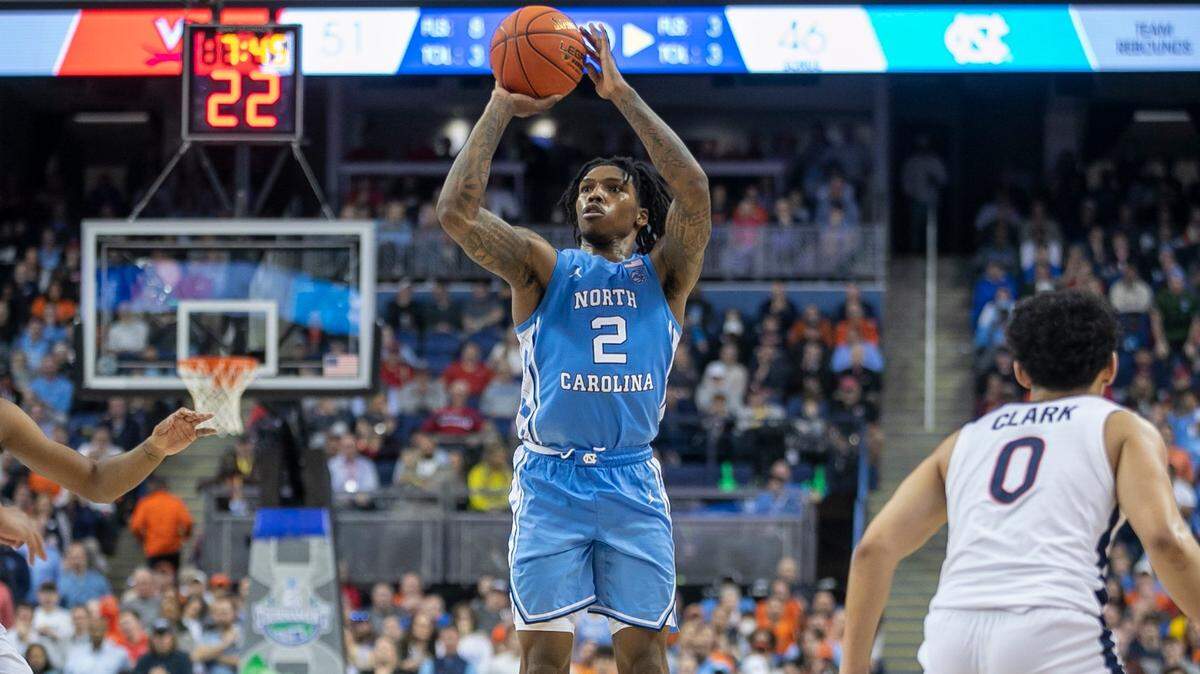 North Carolina’s Caleb Love (2) launches a three point attempt in the second half against Virginia during the third round of the ACC Tournament on Thursday, March 9, 2023 at the Greensboro Coliseum in Greensboro, N.C. Love was 2-10 form the three point line in the Tar Heel’s loss to Virginia.