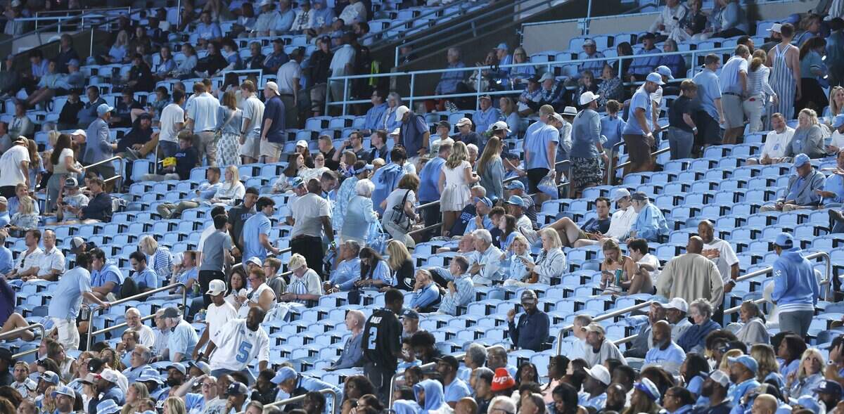 Fans leave the stadium early in the fourth quarter during UNC’s game against TCU at Kenan Stadium in Chapel Hill, N.C., Monday, Sept. 1, 2025.