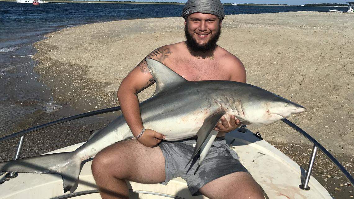 North Carolina Central's Erik Schlecker caught a shark off the coast of Morehead City recently.