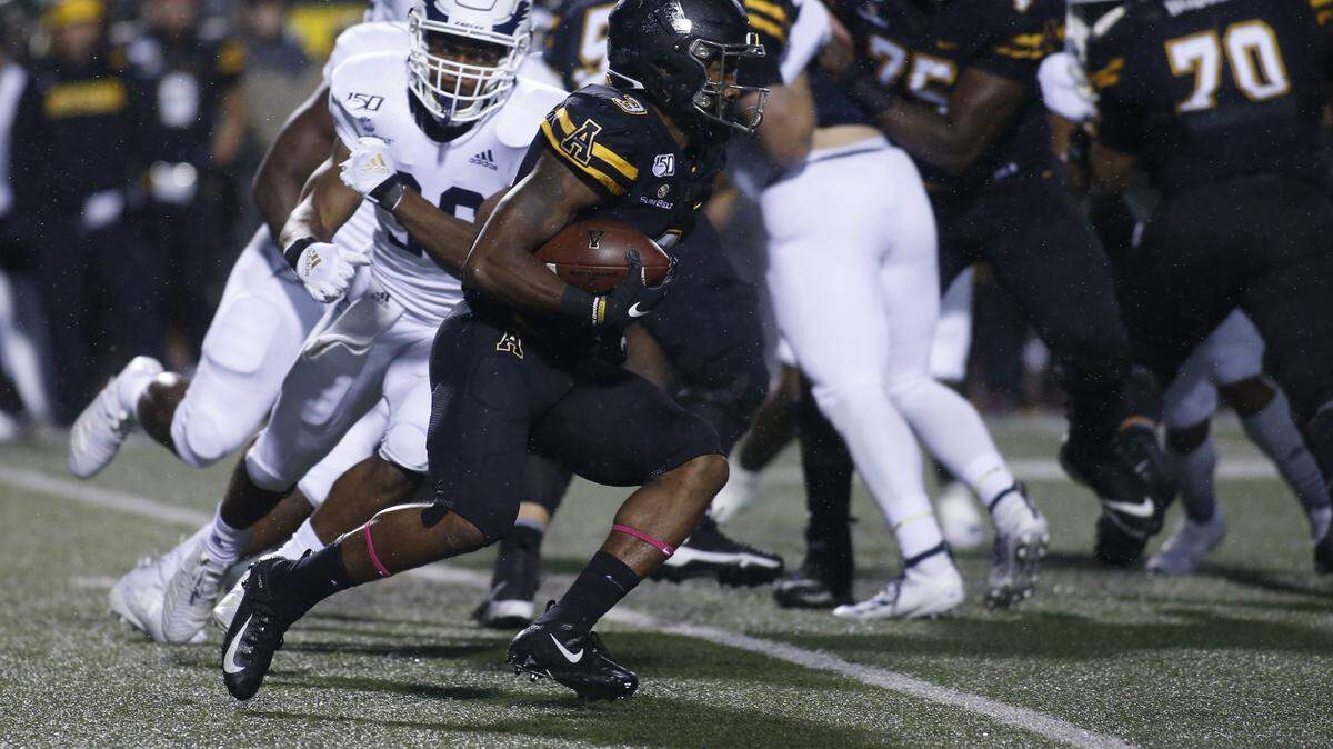 Appalachian State defensive back Shaun Jolly (3) runs the ball during the first half of an NCAA college football game against Georgia Southern Thursday, Oct. 31, 2019, in Boone, NC. (AP Photo/Brian Blanco)