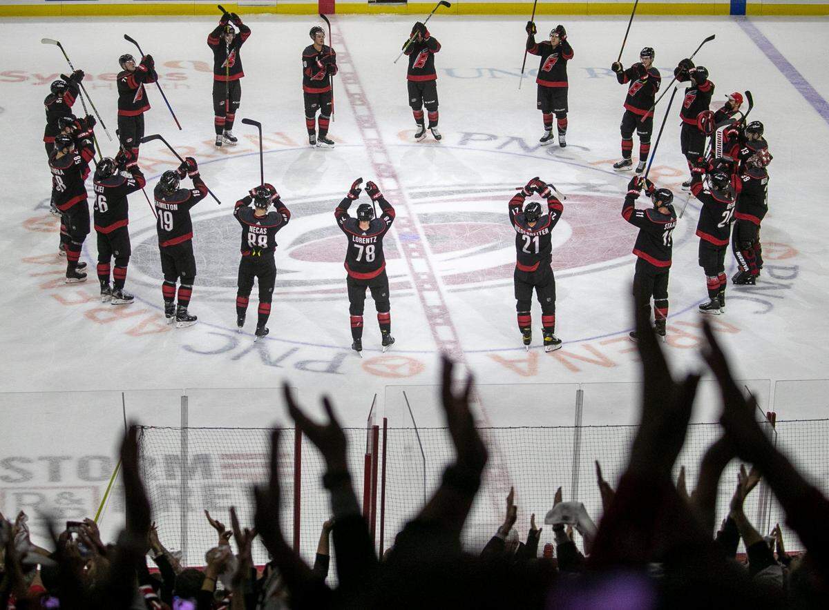 The Carolina Hurricanes celebrate their 3-0 victory over Nashville following game two of their first round Stanley Cup playoff series on Wednesday, May 19, 2021 at PNC Arena in Raleigh, N.C.
