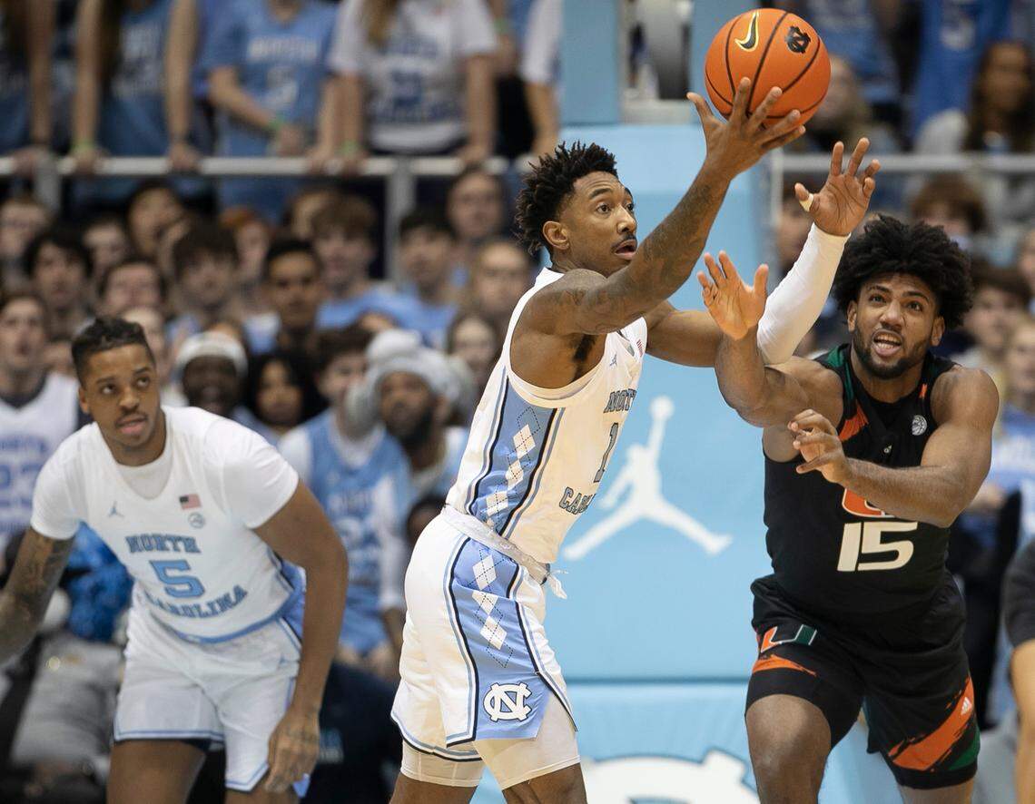 North Carolina’s Leaky Black (1) battles for a defensive rebound with Miami’s Norchad Omier (15) in the first half on Monday, February 13, 2023 at the Smith Center in Chapel Hill, N.C.