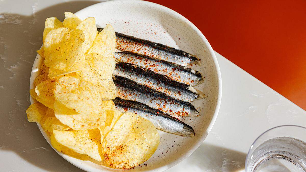A classic Spanish tapas dish, boquerones or cured Spanish anchovies, is served with potato chips at the new Franklin Street restaurant Proximo.