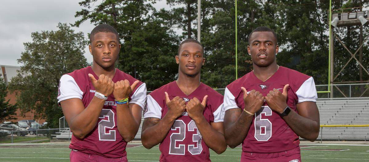 North Carolina Central athletes and Hillside High graduates throw up the Bull City sign in 2018. From left, Chauncey Caldwell, Jamal Currie-Elliott and Daeshawn Stephens.