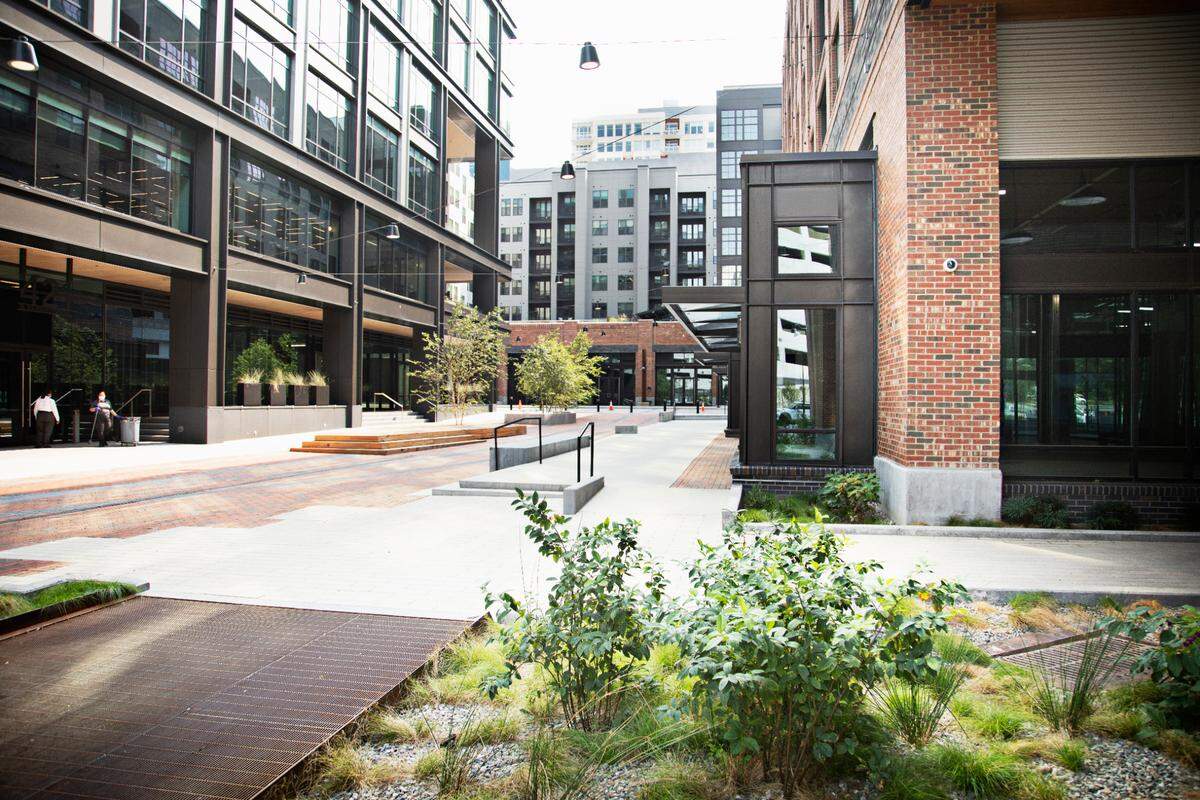 Smoky Hollow, a mixed-use district in downtown Raleigh, has several outdoor gathering areas around open restaurant and retail spaces.