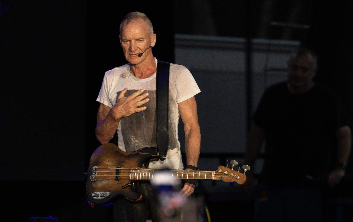 Sting acknowledges the crowd as he takes the stage for his Sting 3.0 tour stop at Raleigh, N.C.’s Red Hat Amphitheater.