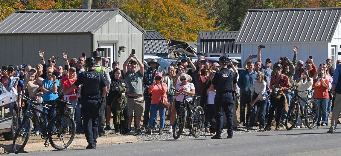 Swannanoa, NC residents line US 70 hoping for a glimpse former President Donald J. Trump during the former president’s tour of damage caused in the area by Hurricane Helene on Monday, October 21, 2024.