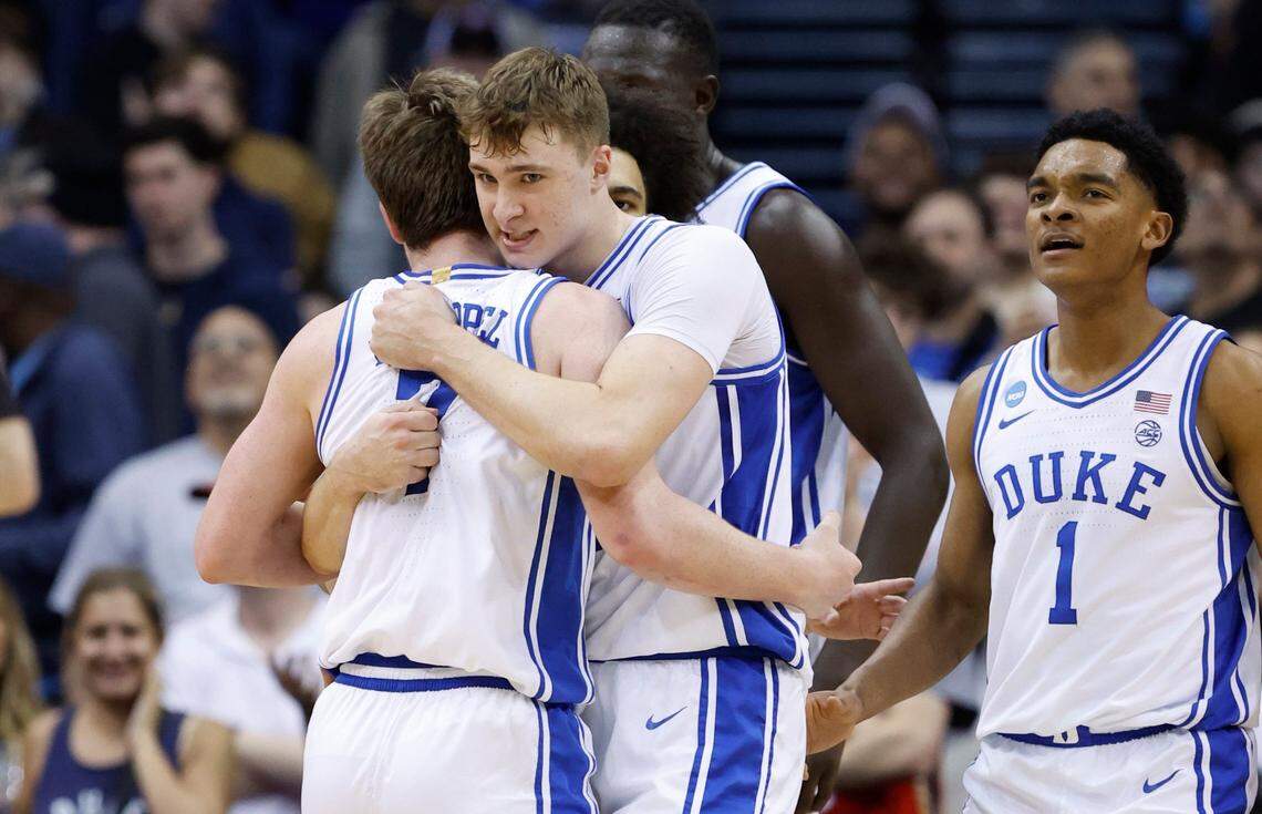 Duke’s Cooper Flagg (2) hugs Kon Knueppel (7) after Flagg made the basket while being fouled during the first half of Duke’s game against Alabama in their Elite 8 game in the 2025 NCAA Men’s Basketball Championship at the Prudential Center in Newark, N.J., Saturday, March 29, 2025.