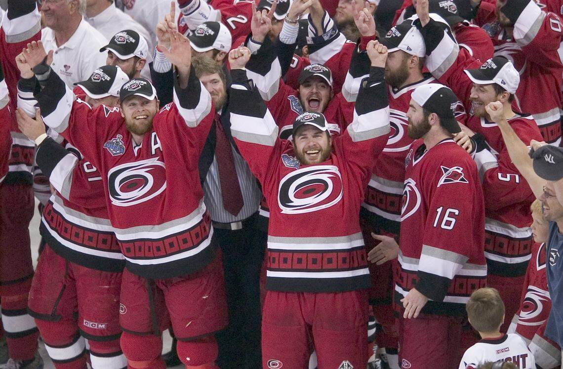 Ray Whitney (center) and teammates celebrate their victory over Edmonton on Monday June 19, 2006 in game seven of the Stanley Cup finals at the RBC Center.