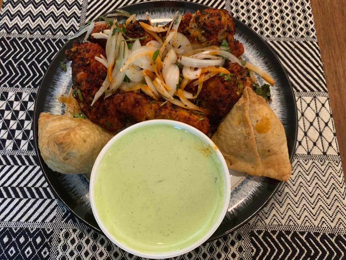 Cilantro Indian Cafe in Cary serves tandoori wings, vegetable samosas and mint-cilantro chutney.