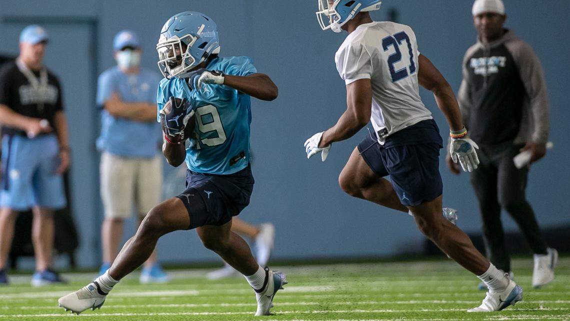 North Carolina running back Ty Chandler (19) carries the ball during the Tar Heels’ first day of practice on Thursday, August 5, 2021 in Chapel Hill N.C.