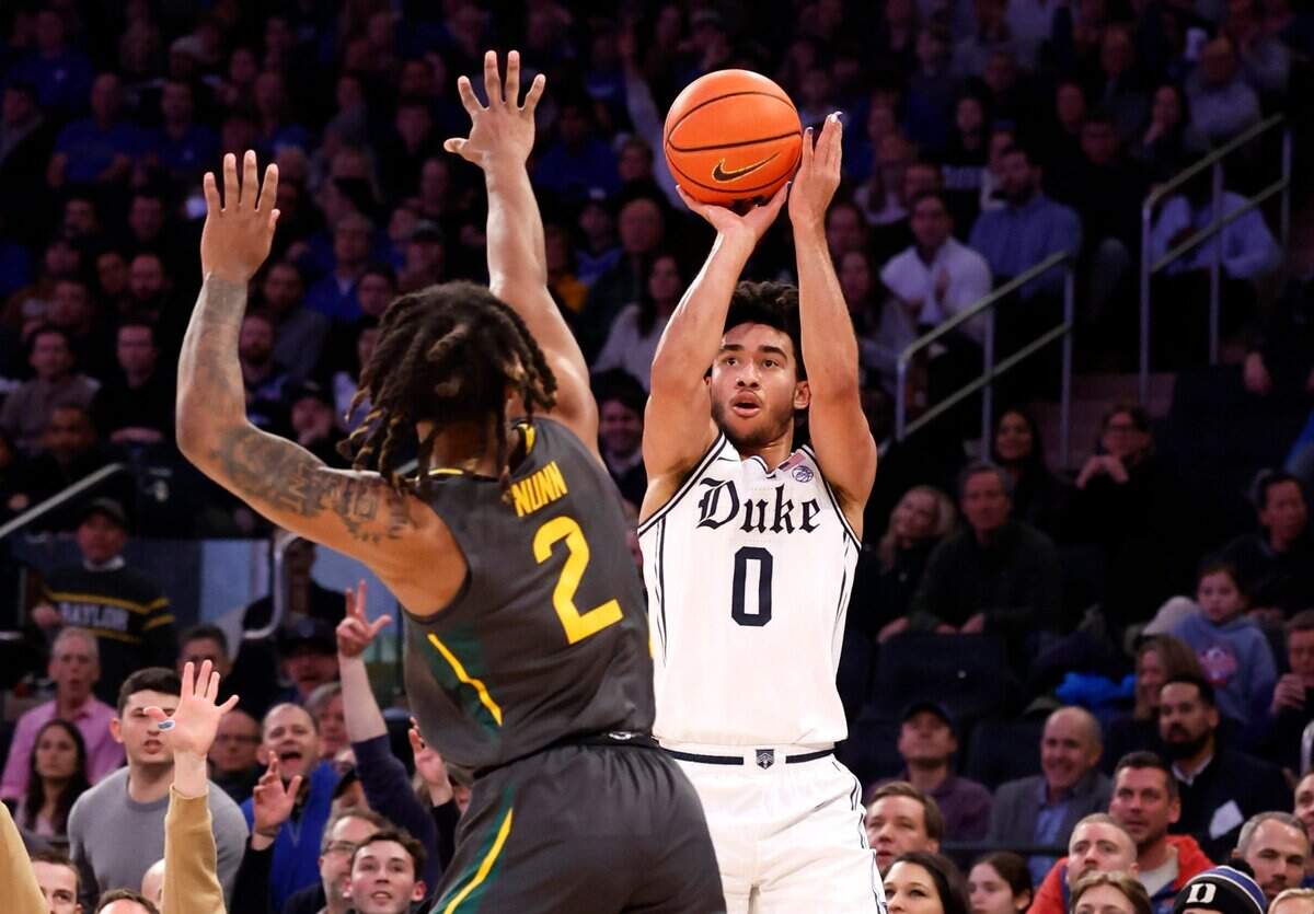 Duke’s Jared McCain (0) shoots as Baylor’s Jayden Nunn (2) defends during the first half of Duke’s game against Baylor at Madison Square Garden in New York City Wednesday, Dec. 20, 2023.