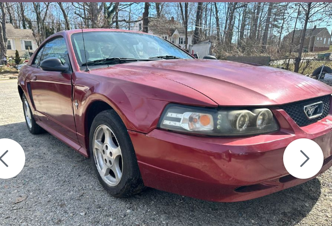 The FBI on Wednesday released this photo of the getaway car, an early 2000 red or burgundy Ford Mustang with a 30-day North Carolina temporary tag.