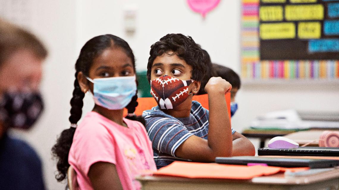 Third graders go over a math test at Carpenter Elementary School in Cary on Thursday morning, Aug. 19, 2021. North Carolina students will start their third school year dealing with the coronavirus pandemic just as the highly contagious delta variant is rapidly spreading across the state.
