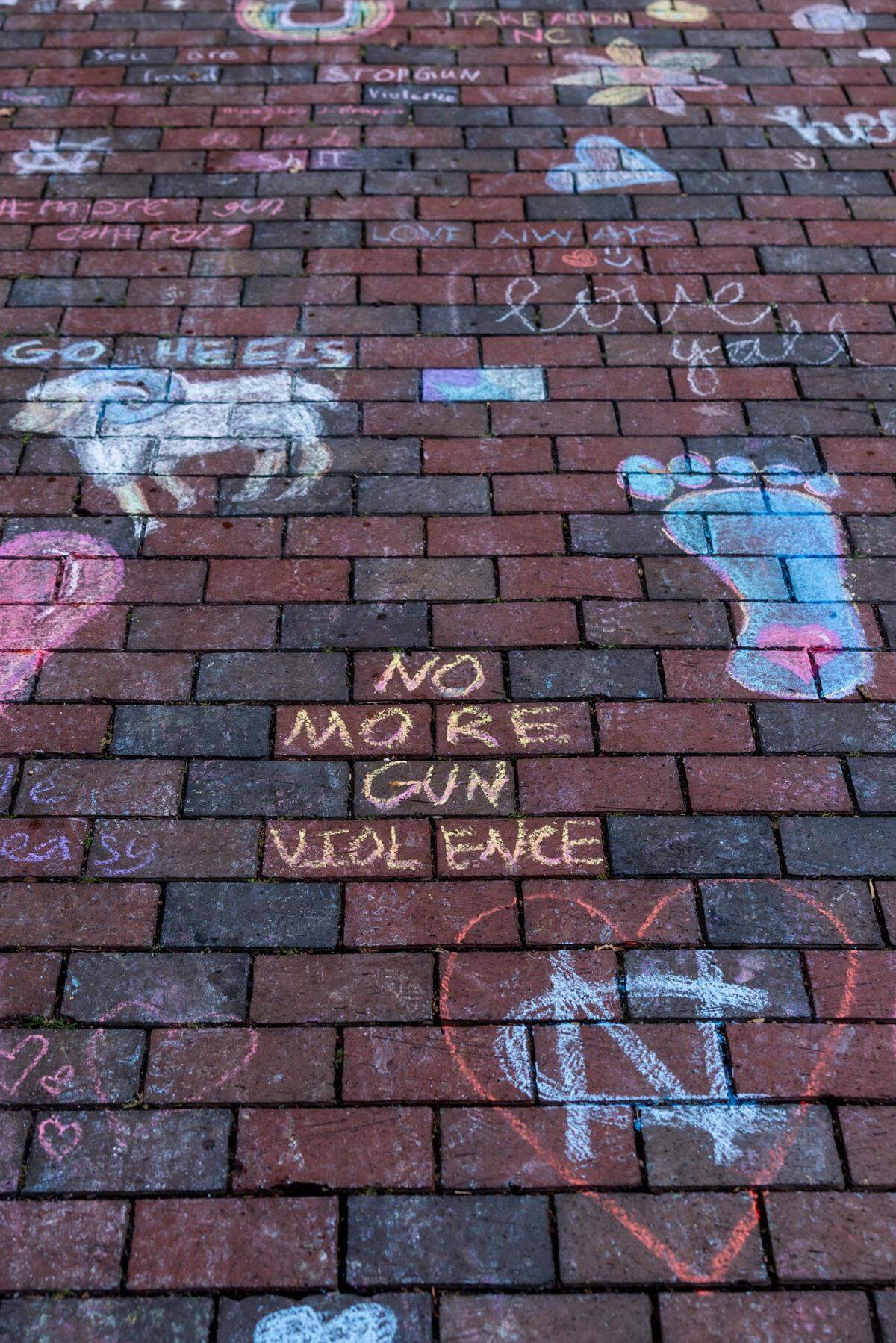 Chalk drawing on UNC-Chapel Hill campus Thursday, Aug. 29, 2023 in honor of professor Zijie Yan who was shot and killed on campus on Monday.
