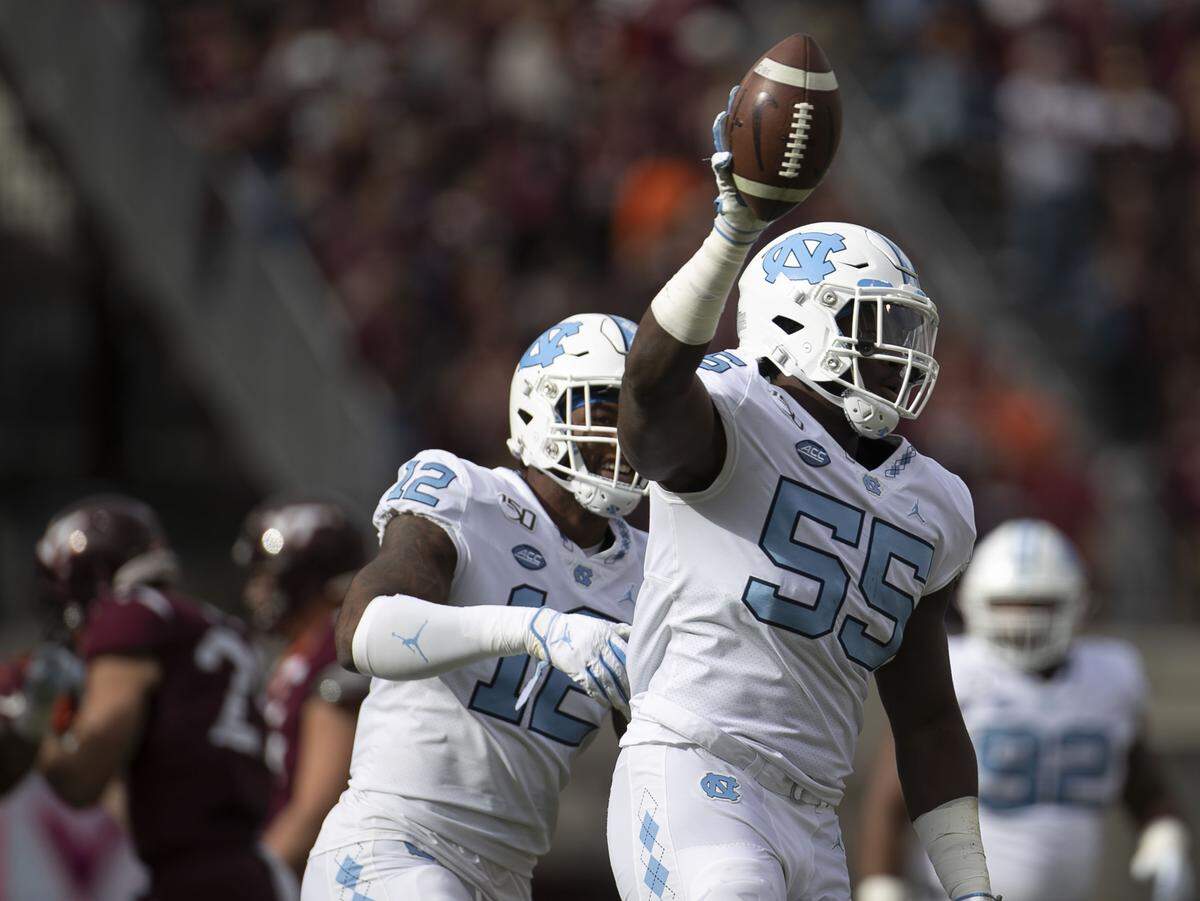 North Carolina’s Jason Strowbridge (55) celebrates after receiving a Virginia Tech fumble in the first quarter on Saturday, October 19, 2019 at Lane Stadium in Blacksburg, Va.