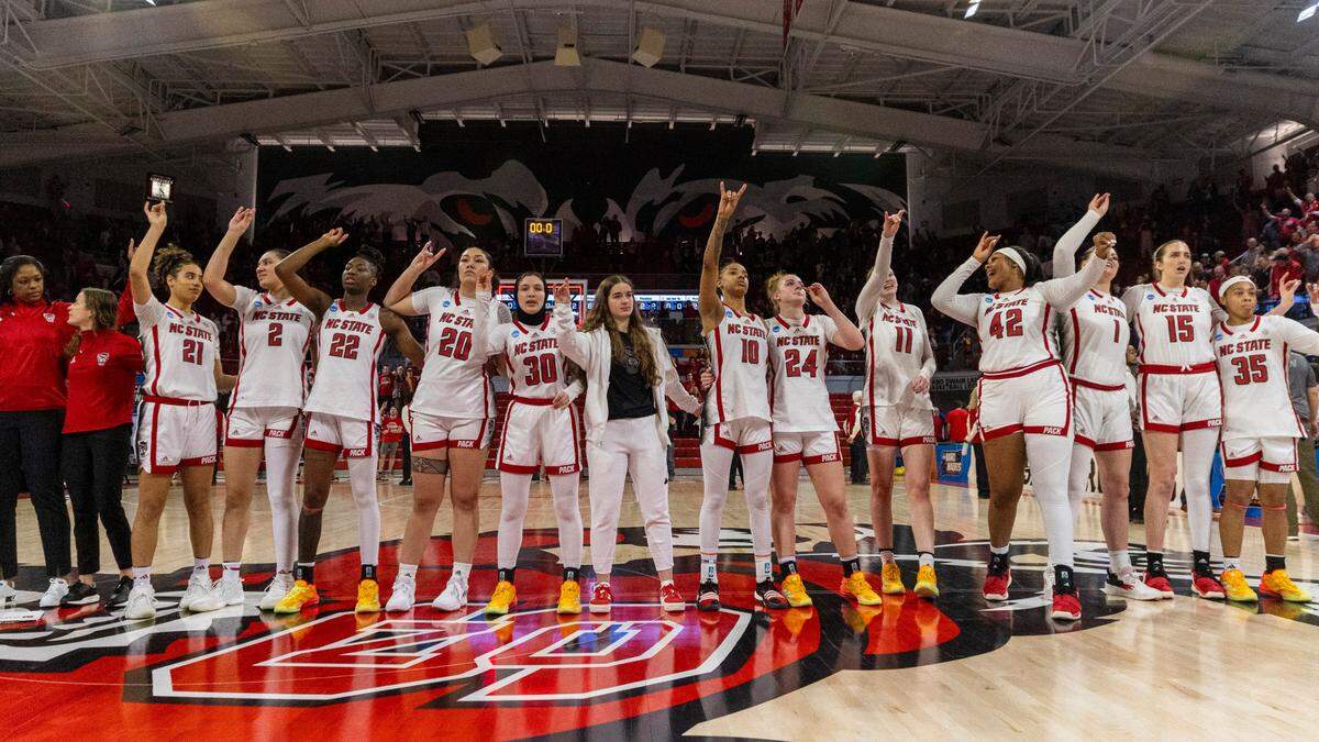 The NC State’s women’s basketball team celebrates a win against Chattanooga during during the first round of the NCAA Division I Women’s Basketball Championship at Reynolds Coliseum in Raleigh, NC on Saturday, March 23, 2024. N.C. State won 64-45.